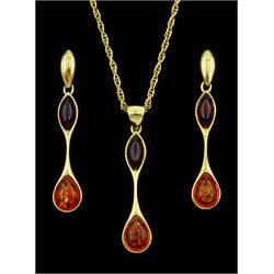 Gold two tone amber pendant necklace and a pair of gold matching stud earrings, all 9ct