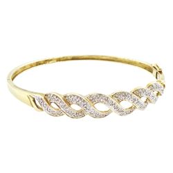 9ct gold diamond chip diamond crossover bangle, Birmingham import mark, total diamond weig...