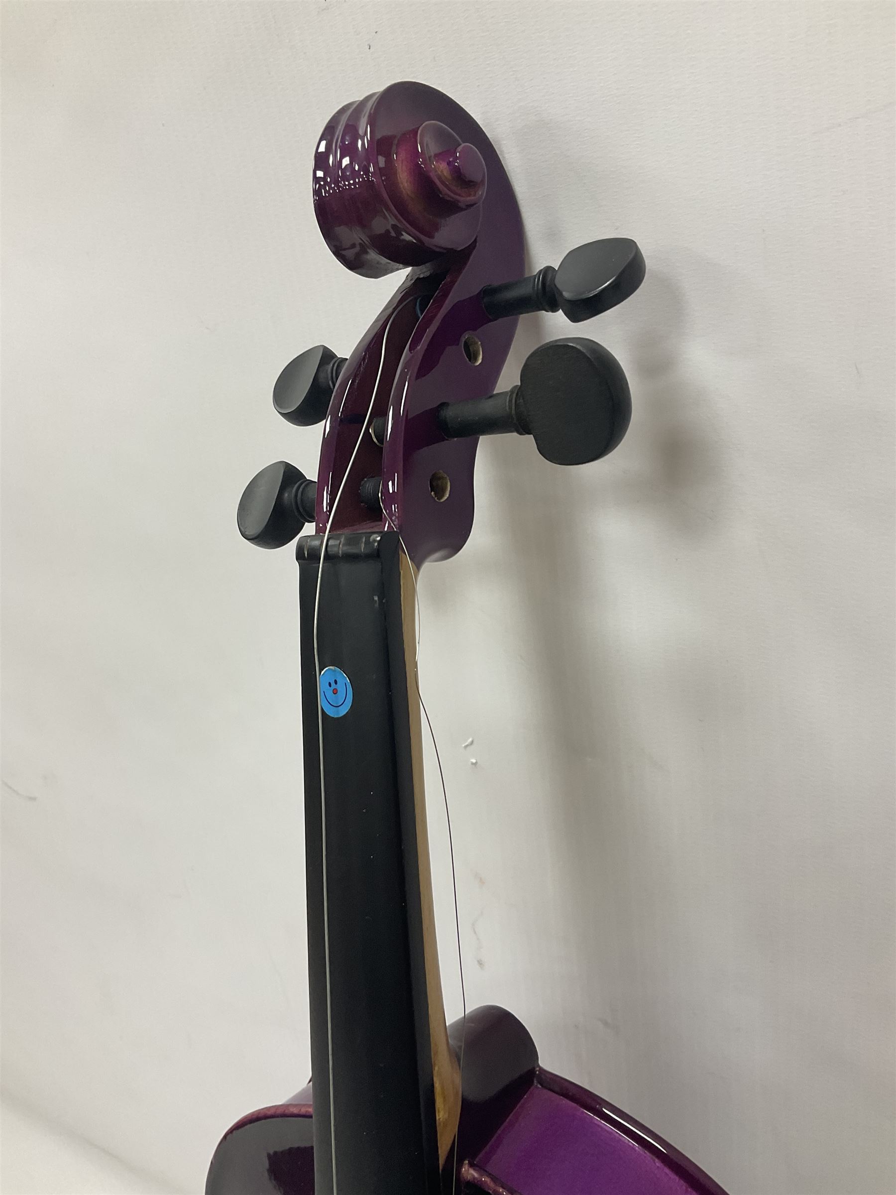 Intermusic 3/4 violin with a violet coloured solid wood body, ebonised fingerboard and fittings, bow and hard case, length 54cm