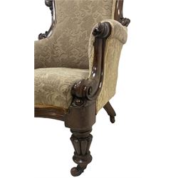 William IV mahogany framed armchair, rolled back with scroll carved uprights, acanthus carved arm terminals over serpentine fronted seat, raised on turned and lobe carved supports with castors