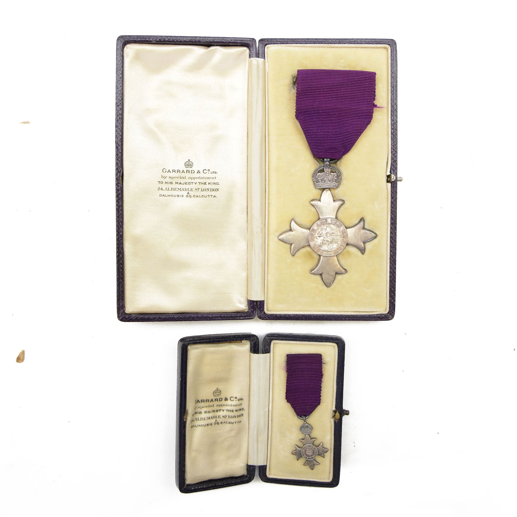 The Most Excellent Order of the British Empire, George V, M.B.E. breast badge, silver-gilt, hallmarked Garrard & Co Ltd, London, housed in an M.B.E. case, together with matching miniature in case, attributed to Joseph Percival Sykes  