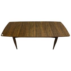 Mid-20th century figured walnut extending dining table, pull-out action with fold-out leaf, on tapering supports 