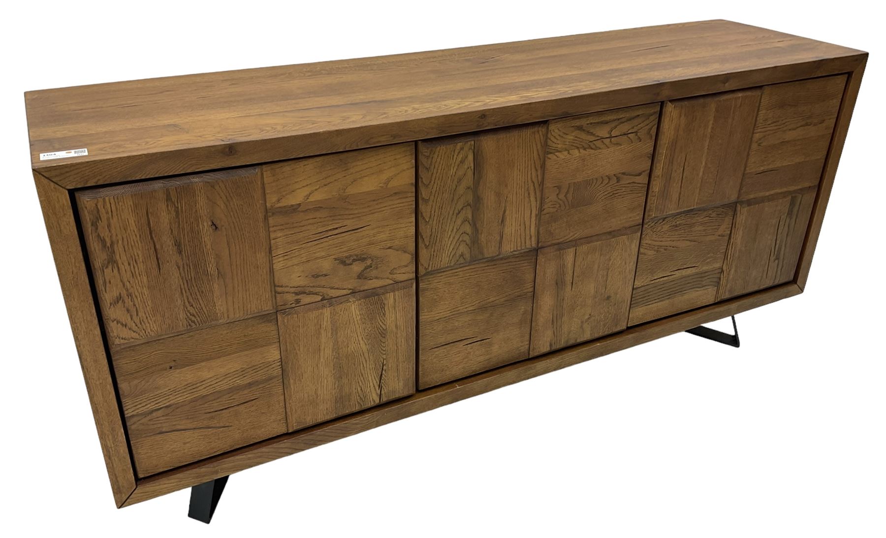 Samba 'Camden' oak sideboard, rectangular top over three block panelled cupboard doors, raised on angled black metal supports connected with stretcher