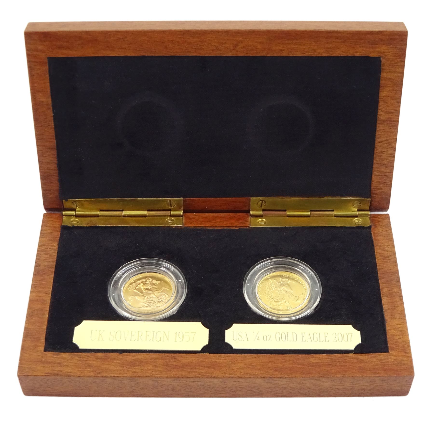 Two gold coin set comprising Queen Elizabeth II 1957 gold full sovereign coin and United States of America 2007 quarter ounce fine gold ten dollar coin, housed in a display case