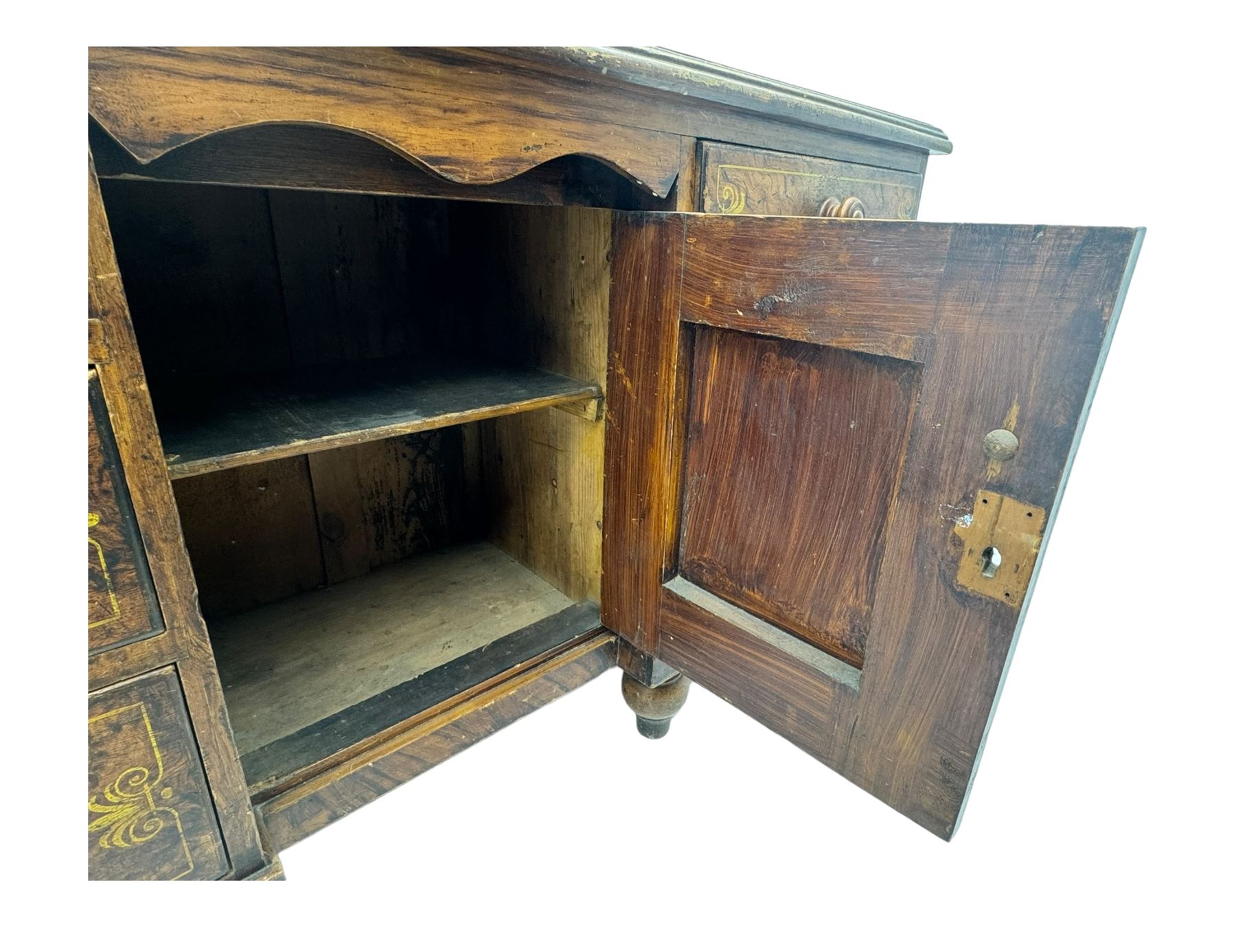 Victorian walnut scumbled pine sideboard, stepped rectangular top over central cupboard with marquetry inlay, flanked by two banks of three drawers fitted with round wooden knobs, raised on turned bun supports