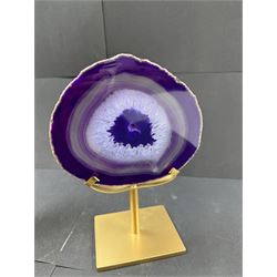 Pair of purple agate slices, polished with rough edges, raised upon gilt metal stands, H22cm