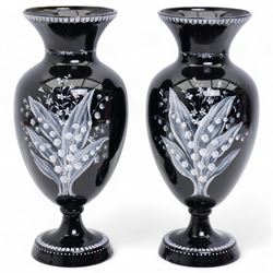 Pair of Victorian black glass vases, of baluster form, decorated with blossoming floral de...