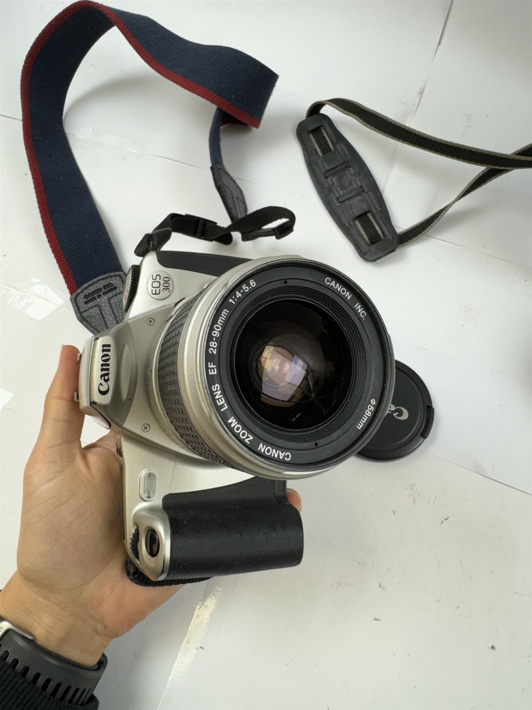 Three Canon EOS cameras, comprising EOS 500N Silver Kit, serial no. 9660130 with Canon EF 28-80mm 1:3.5-5.6 IV zoom lens, serial no. 9505171, EOS 300 with Canon EF 28-90mm 1:4-5.6 zoom lens, serial no. 5828460, and a Sigma 28-300mm 1:3.5-6.3 macro zoom lens, serial no. 1027931 and an EOS 600 camera body, serial no. 2651130, two boxed and one in carry case