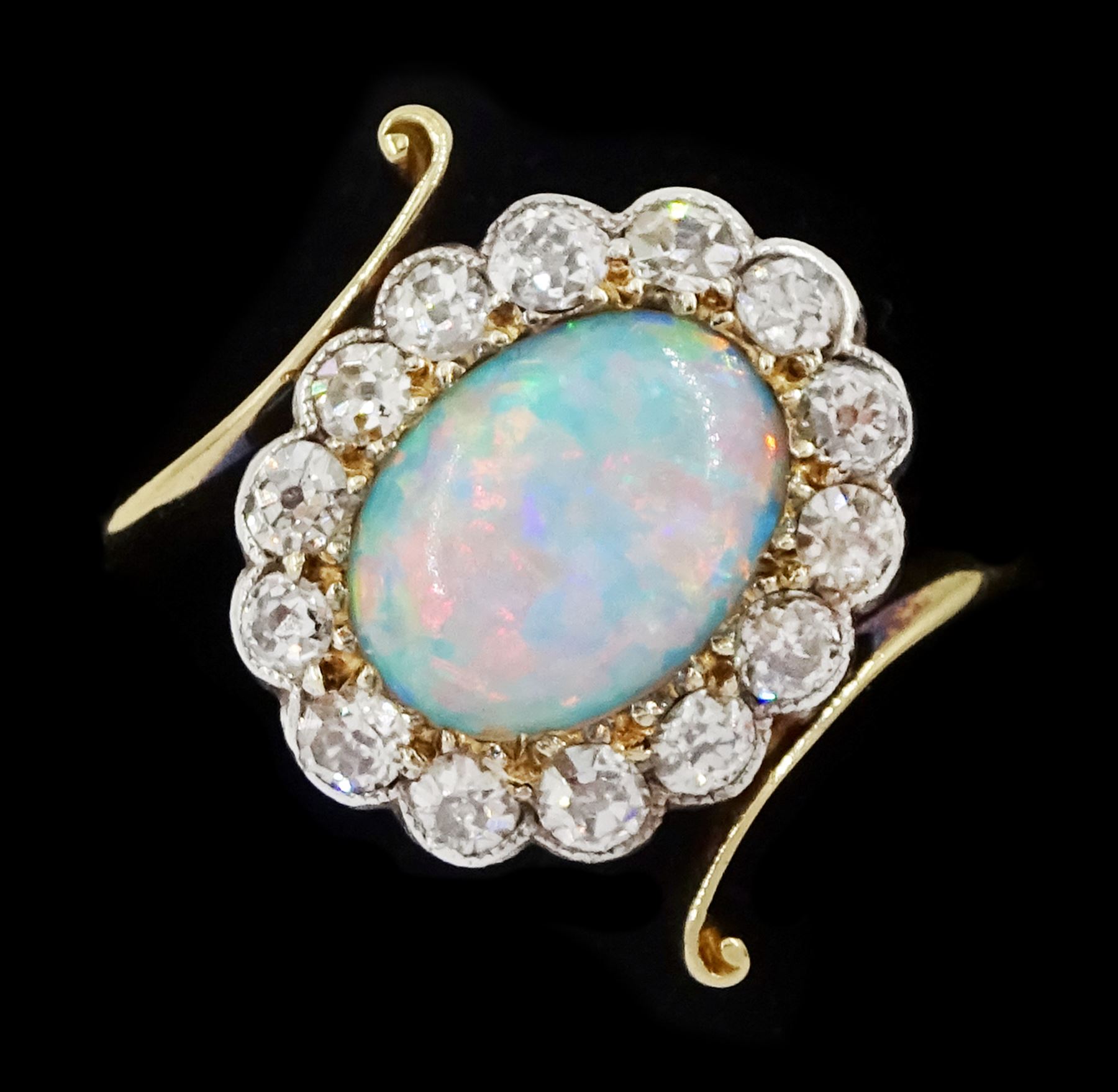 Early 20th century gold opal and milgrain set old cut diamond cluster ring, with twist scroll shoulders, stamped 18ct, total diamond weight approx 0.55 carat