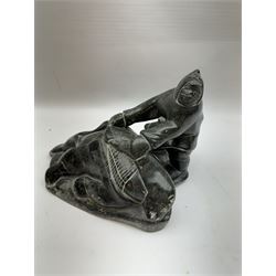 Inuit soapstone carving, of a hunter and a polar bear, circa 1960, H19cm 