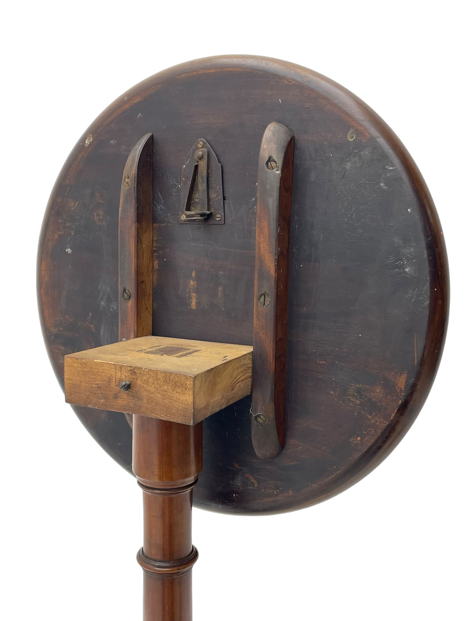 George III mahogany tripod table, circular moulded dished tilt-top, ring turned stem on three splayed supports 