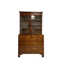 George III mahogany chest of drawers surmounted by a later bookcase, dentil cornice over inlaid frieze and astragal glazed doors, the chest fitted with two short over three long cock-beaded drawers, on bracket feet