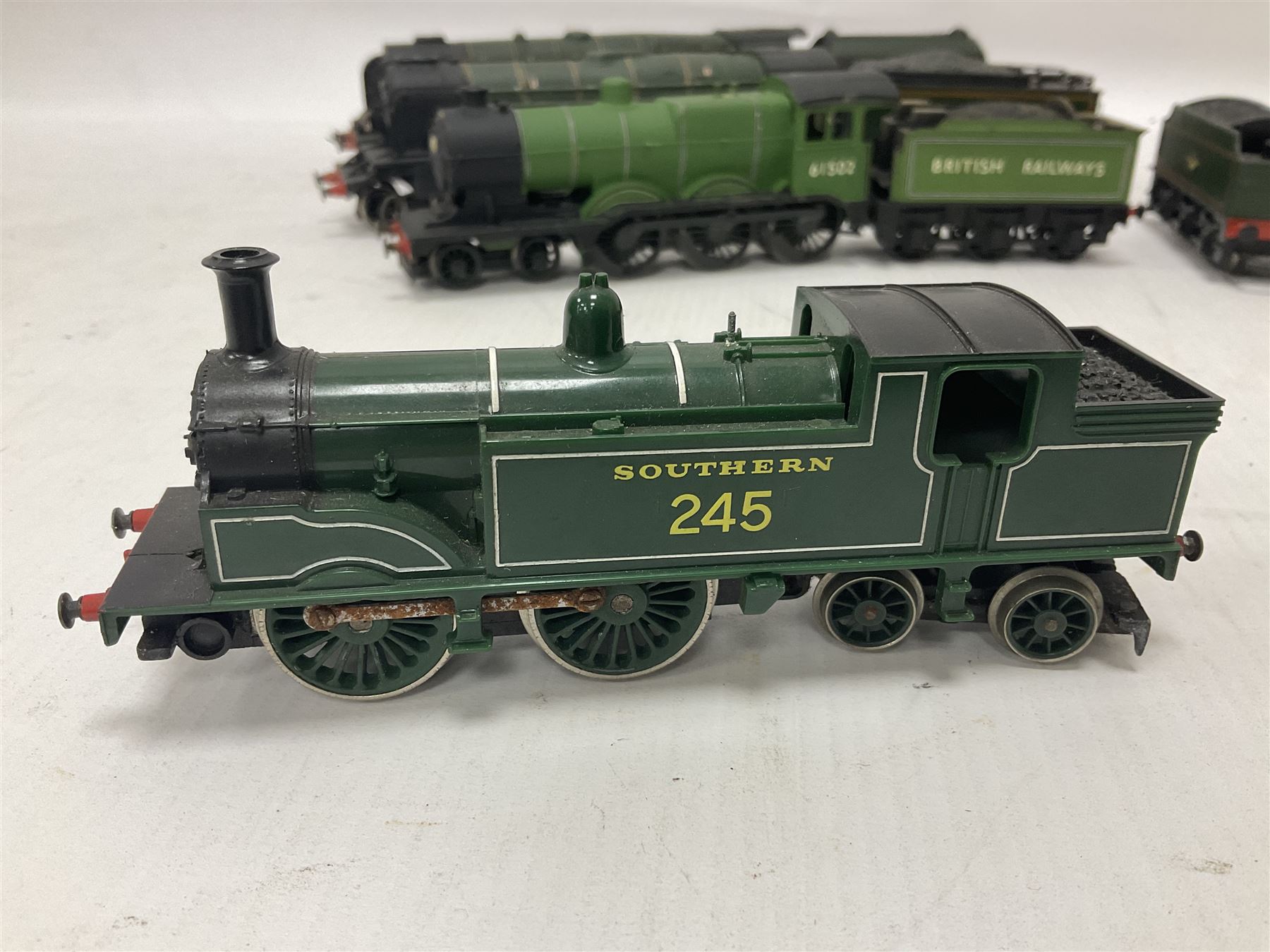 ‘00’ gauge - four hand built locomotives, using various Hornby parts, comprising Duchess Class 4-6-2 ‘City of Glasgow’ no.46242 in BR green; Class A3 4-6-0 ‘Humdrist’ no.60097 in BR green; Class B12 4-6-0 no.61502 in BR green; M7 Class 0-4-4T no.245 in southern green; with Hornby tender in BR green (5) 