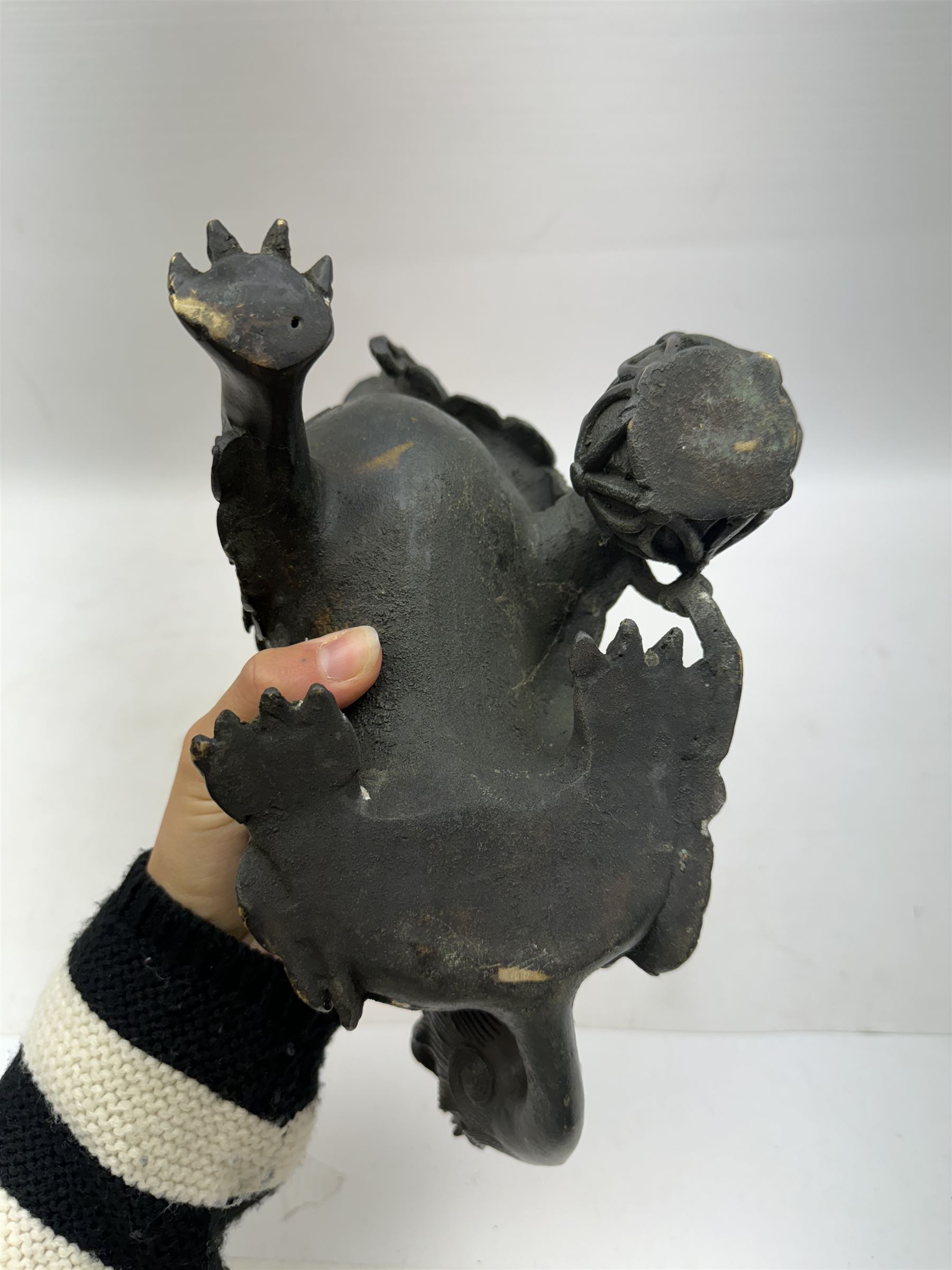 Bronze dog of foo, modelled with one paw placed upon ball, H18cm