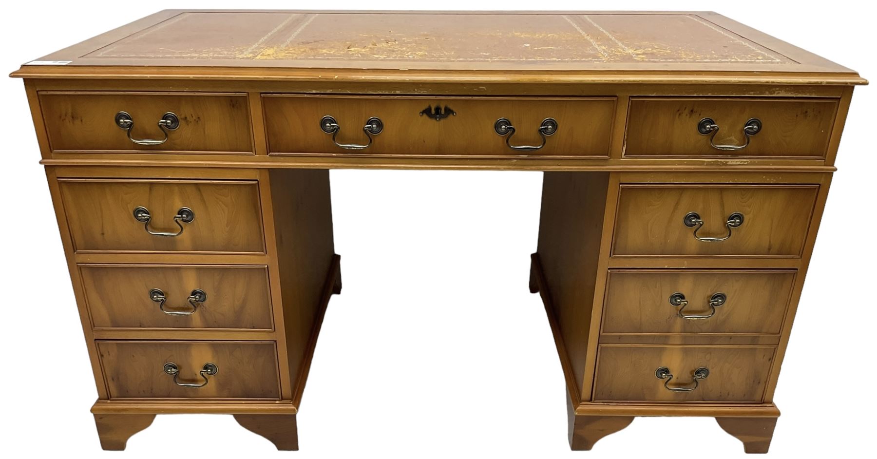 Georgian design yew wood twin pedestal desk, moulded rectangular top over nine cock-beaded drawers, on bracket feet