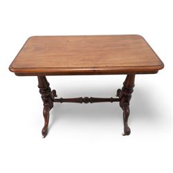 Victorian mahogany stretcher table, moulded rectangular top with rounded corners, on turned twin pillar supports united by turned and carved stretcher, on carved out splayed supports with brass and ceramic castors 