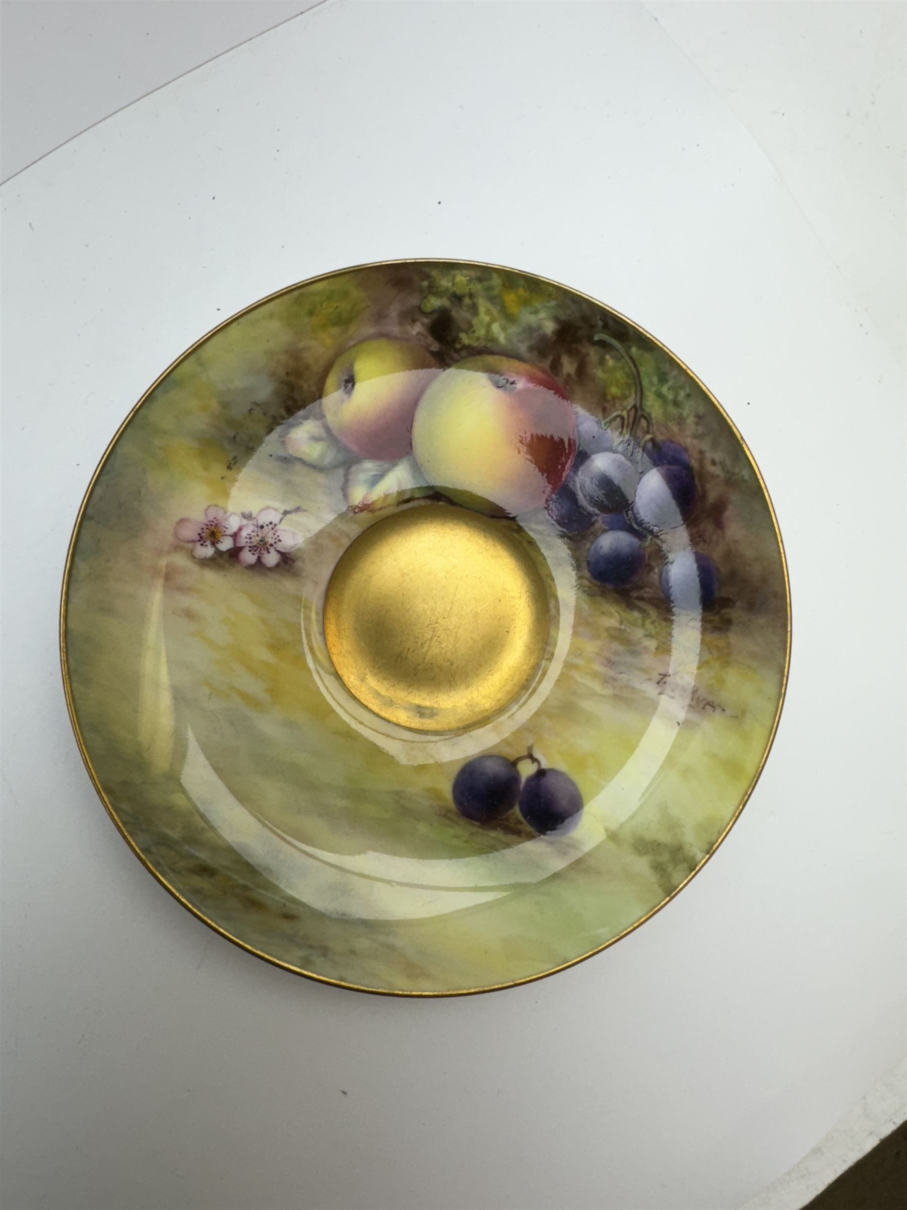 Early 20th century Royal Worcester cup and saucer decorated by Thomas Lockyer, the interior of the cup and the saucer decorated with fruit to a mossy background, with puce printed mark beneath 