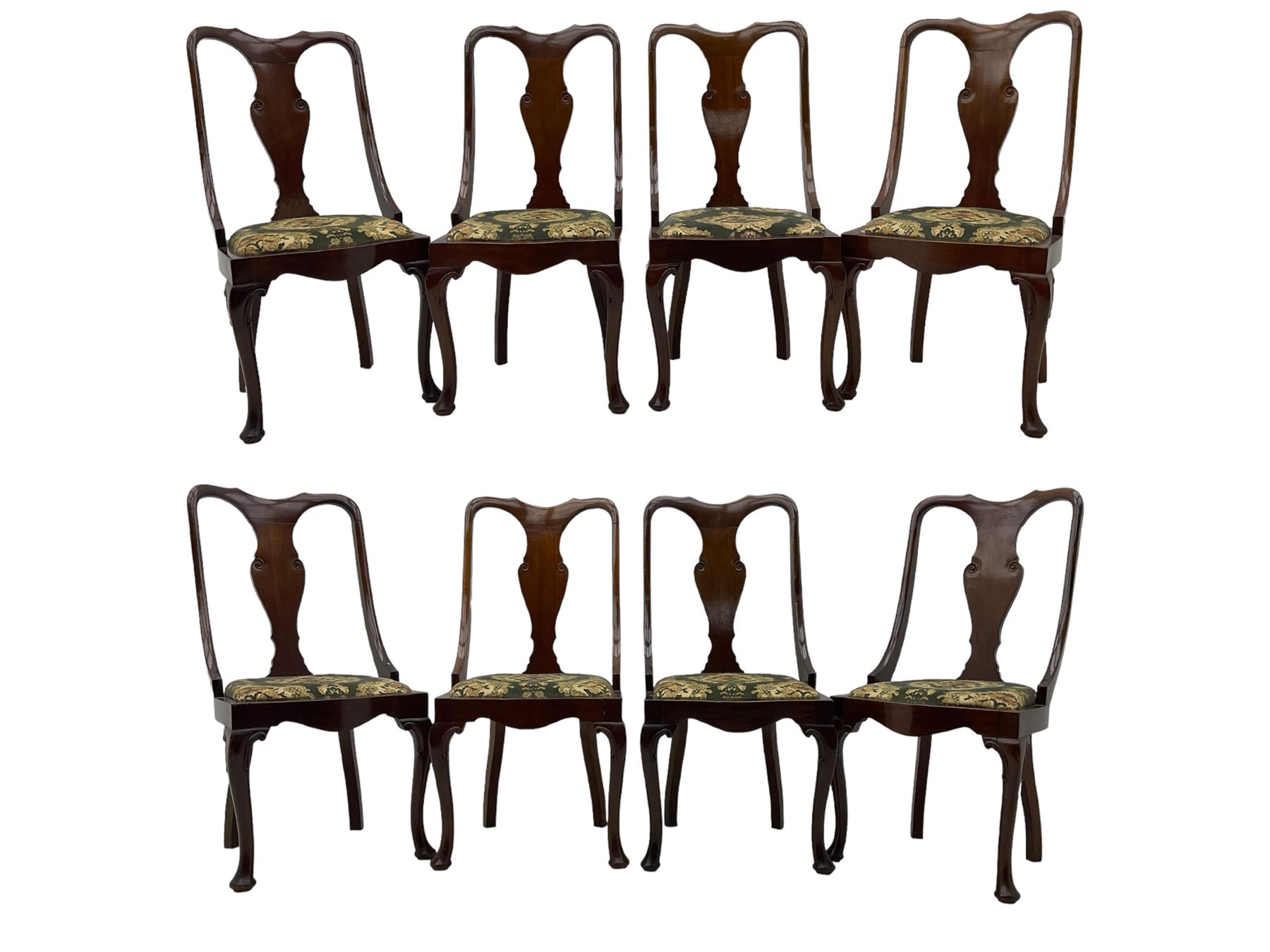 Set of eight late 19th century mahogany spoon back dining chairs, each with shaped top rail over Queen Anne design vase-shaped splat, upholstered seats in floral patterned fabric, raised on cabriole supports with scroll carved knees