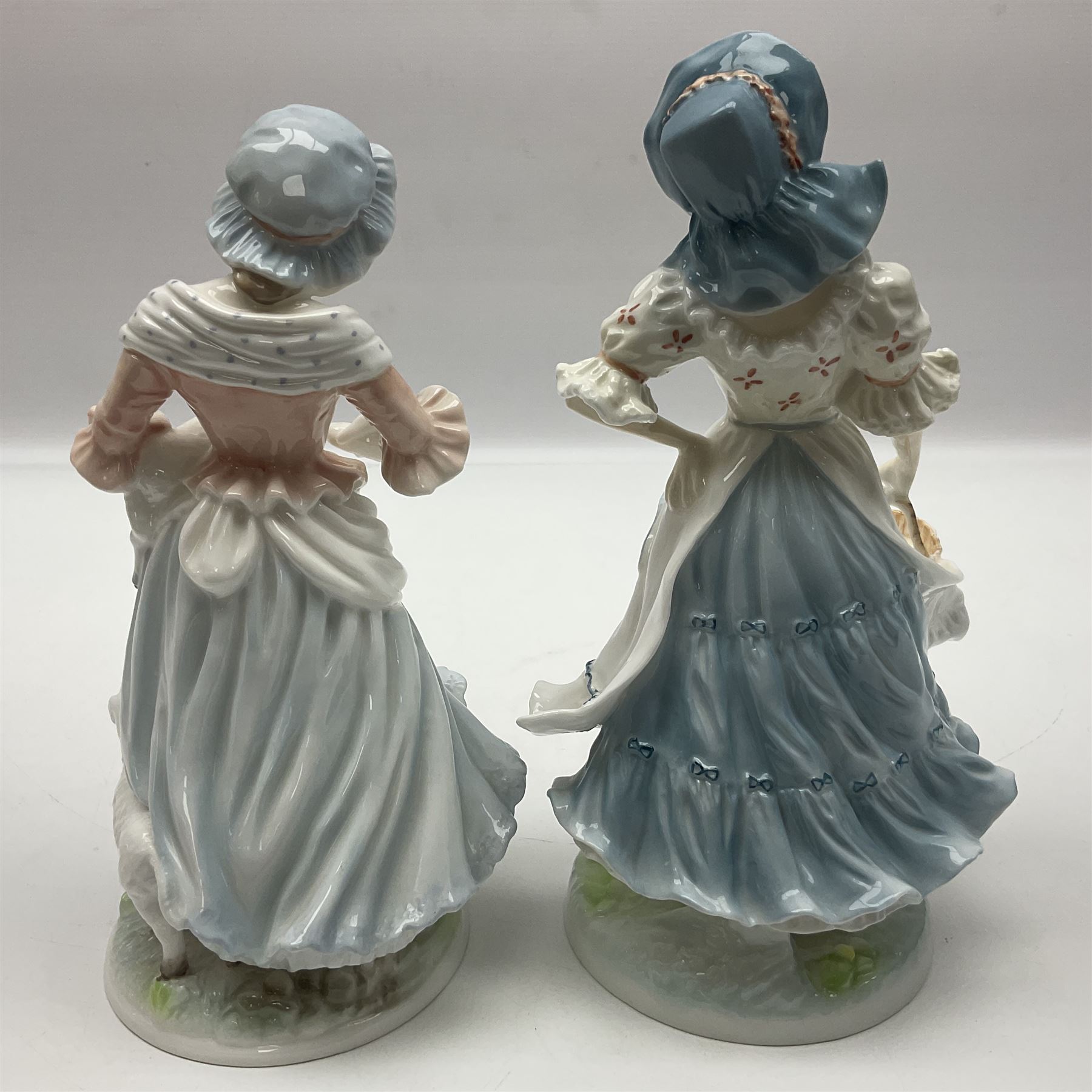 Five Royal Worcester figures, comprising The Queen of May, Rosie Picking Apples, A Farmers Wife, The Milkmaid and The Shepherdess, all with printed marks beneath and some with certificates of authentication   