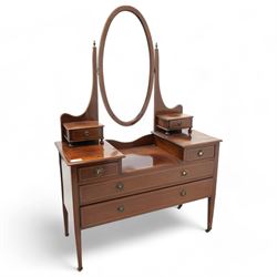 Edwardian inlaid mahogany drop-centre dressing table, bevelled oval swing mirror over trinket drawers, fitted with two short and two long drawers, on square tapering supports with brass castors