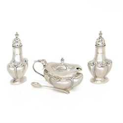 Art Nouveau silver three piece cruet set, comprising salt and pepper shakers and a mustard...