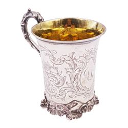 Victorian silver christening mug, of cylindrical form with fluted rim, gilt interior and acanthus capped C scroll handle, the body with later engraved decoration and initials, with embossed scroll base, hallmarked John Evans II, London 1840, including handle H10.2cm