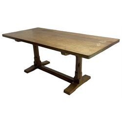 Rabbitman - oak dining table, rectangular adzed top on octagonal supports, on sledge feet joined by floor stretcher, carved with rabbit signature, by Peter heap, Wetwang 