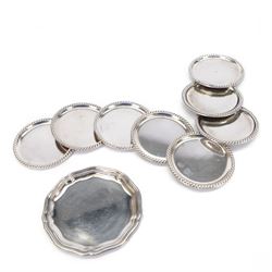 German silver pin tray, with shaped rim, together with set of eight German silver coasters...