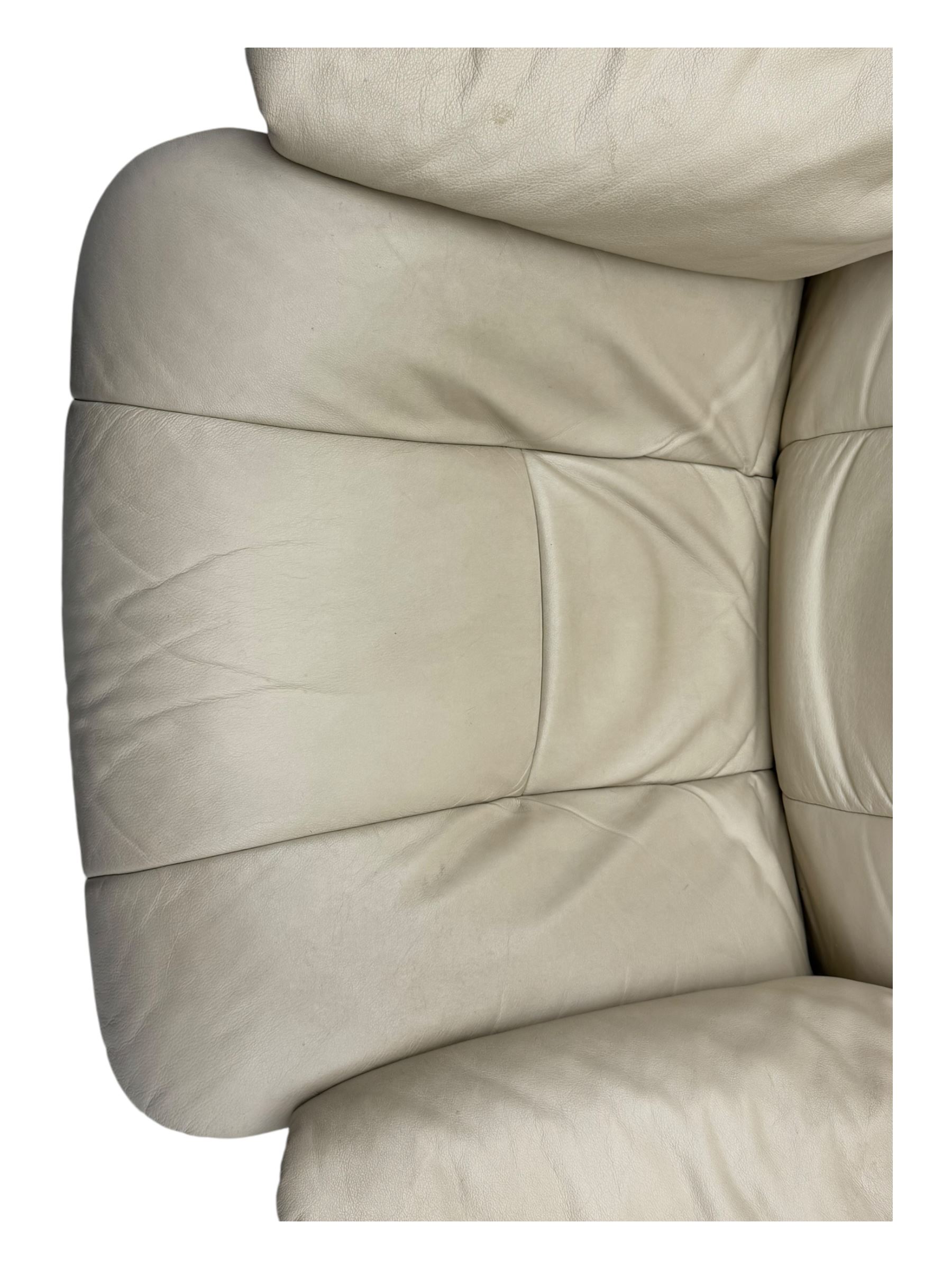 Ekornes Stressless - swivel armchair upholstered in cream leather (W81cm, H103cm); together with matching stool (W49cm)