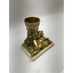 Gilt metal spill vase, the vase modelled as a a barrel with putti amongst fruiting vines laid before, upon rectangular base and rectangular marble plinth, H13.5cm