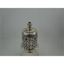 1920s silver sugar caster, of typical waisted form, the removable pierced floral cover with urn finial, hallmarked Charles Perry & Co, Chester 1929, H17cm