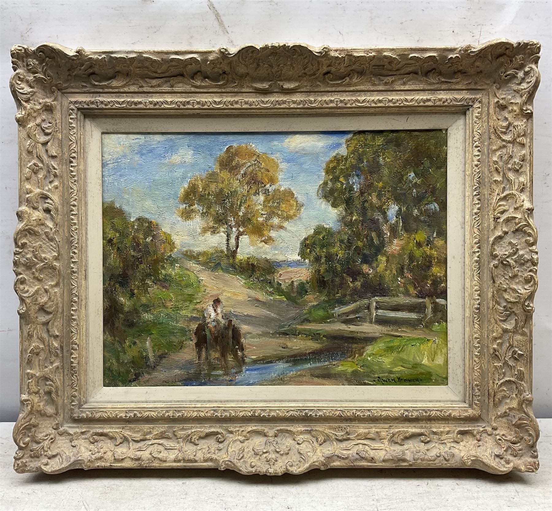 Owen Bowen (Staithes Group 1873-1967): Horse and Rider Watering by a Bridge, oil on board signed 29cm x 39cm