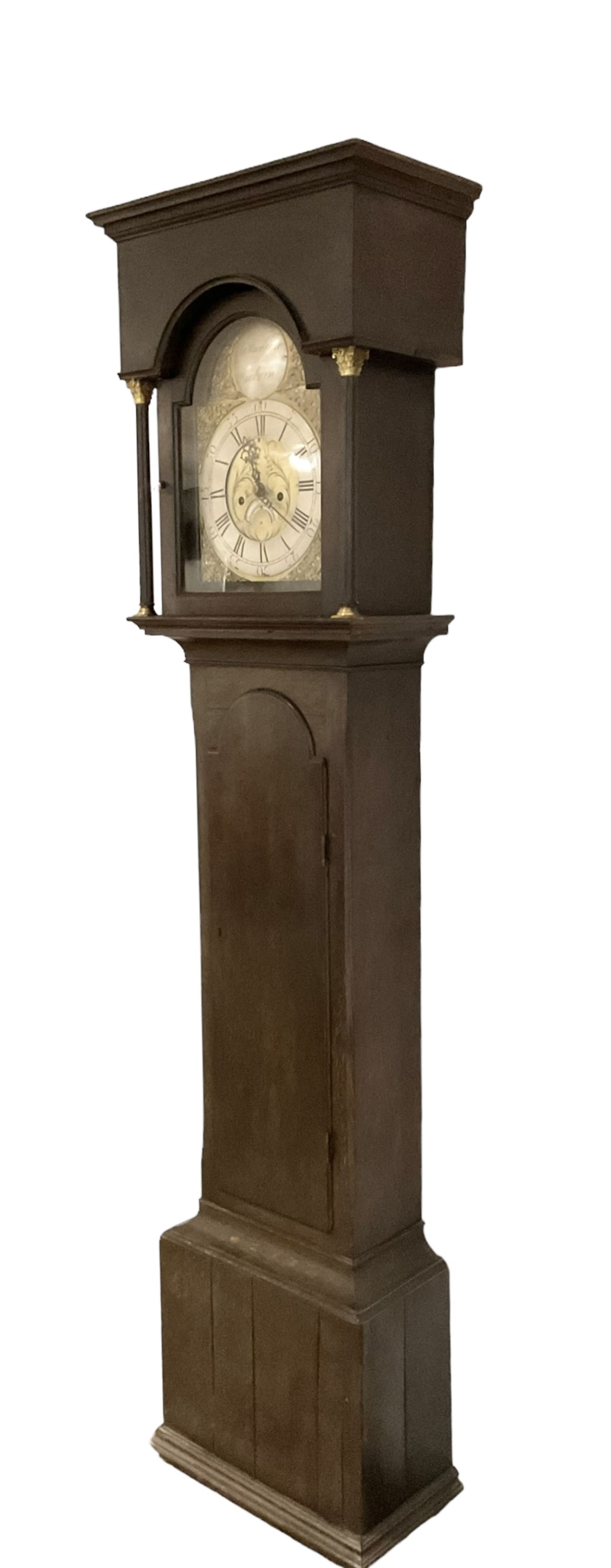 Charles Woodward of Newburn - late 18th century 8-day oak longcase, hood with a flat top and break arch hood door flanked by reeded pilaster with Corinthian capitals, long trunk door with a break arch top on a square plinth with narrow moulding to the base, brass dial with a silvered boss to the arch and cast spandrels, engraved dial centre with calendar aperture and matching steel hands, dial pinned to a rack striking movement, striking the hours on a bell. With pendulum and weights.