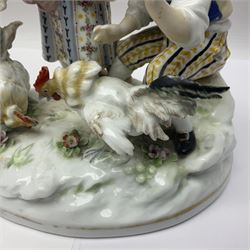 Two 19th century german figures, each modelled as children feeding birds, H19cm 