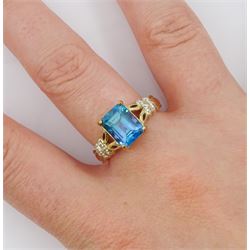 9ct gold blue topaz ring, with white topaz shoulders, hallmarked