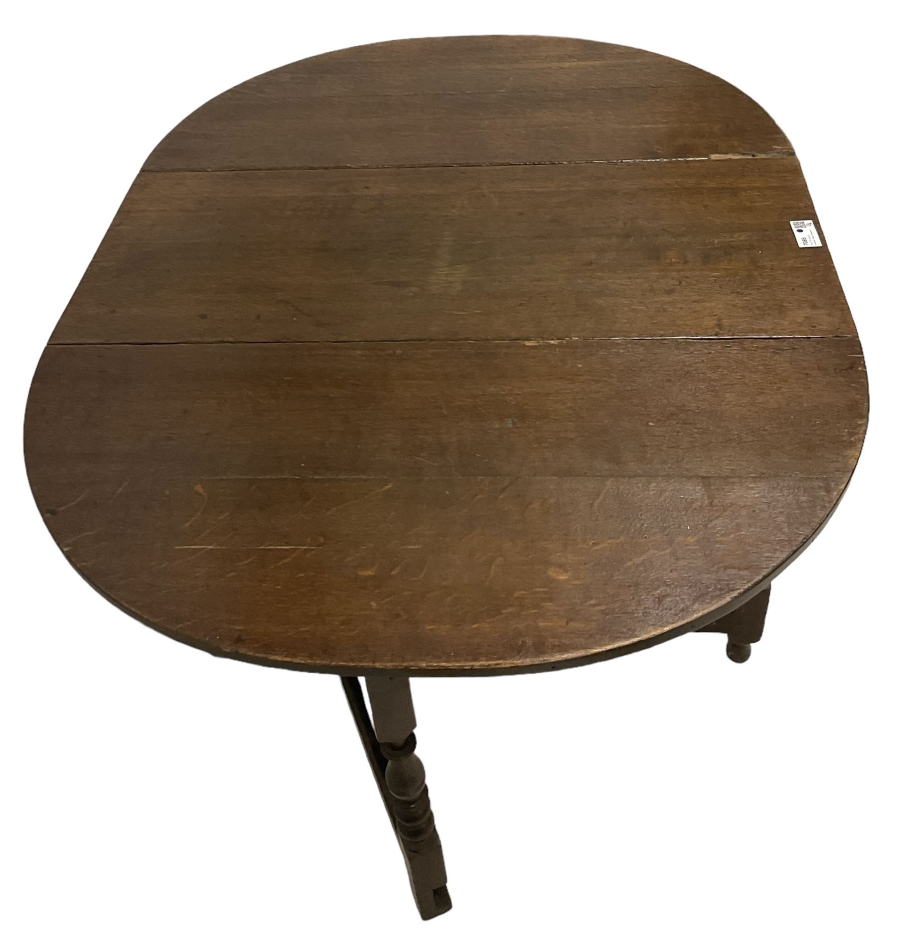 18th century country oak drop-leaf table, oval top, fitted with single drawer, raised on double gate-leg action bobbin-turned supports, united by stretchers