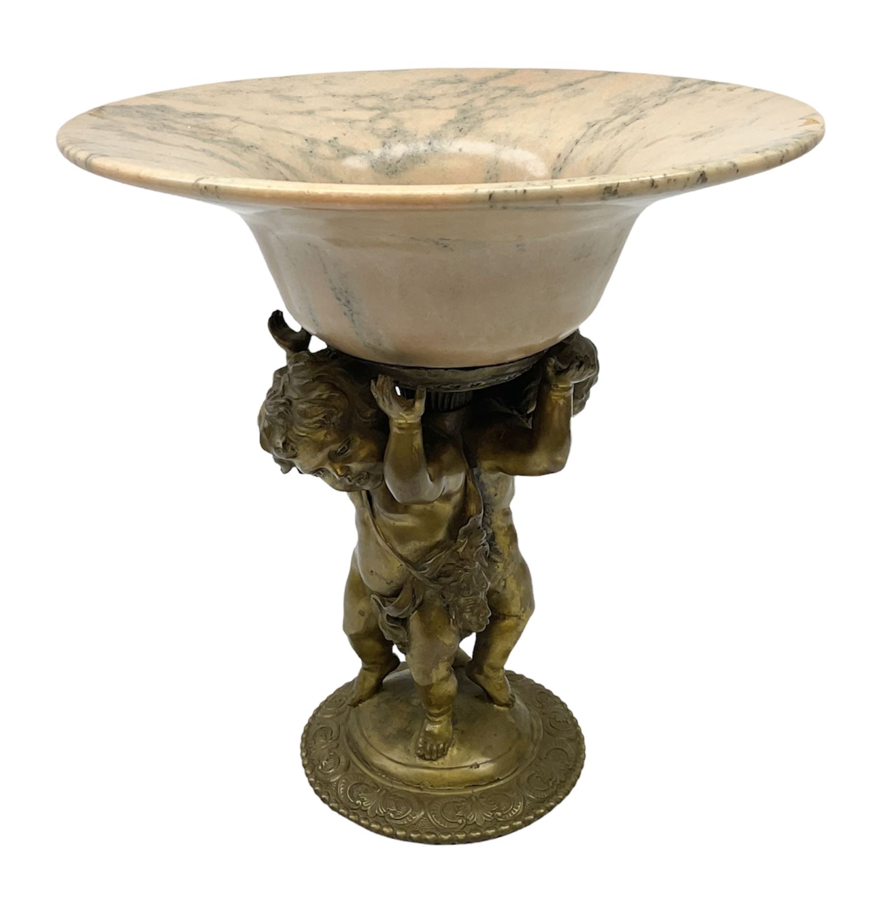 Brass centrepiece modelled as two cherubs supporting a marble bowl, stood upon a foliate design base, H32cm