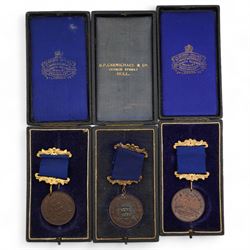 Eighteen Hull Education Committee 'Perfect Attendance At School' medallions, six cased and three Hull Times Long Service Medals 'For 25 Years Continuous Service', housed in a Lindner tray