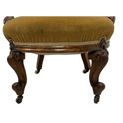 19th century walnut framed open armchair, scallop shaped back with c-scroll uprights, upholstered in yellow buttoned velvet fabric with sprung seat, arm terminals carved with acanthus leaves, raised on scrolling cabriole supports with castors