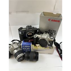 Three Canon EOS cameras, comprising EOS 500N Silver Kit, serial no. 9660130 with Canon EF 28-80mm 1:3.5-5.6 IV zoom lens, serial no. 9505171, EOS 300 with Canon EF 28-90mm 1:4-5.6 zoom lens, serial no. 5828460, and a Sigma 28-300mm 1:3.5-6.3 macro zoom lens, serial no. 1027931 and an EOS 600 camera body, serial no. 2651130, two boxed and one in carry case