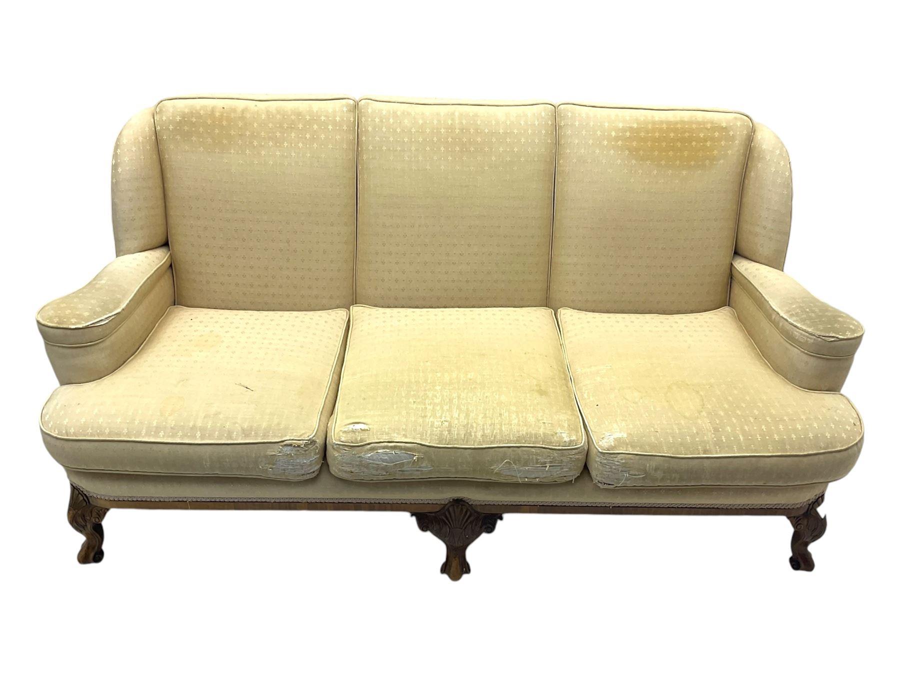 Late 20th century mahogany framed three seat sofa, upholstered in cream fabric with repeating cross pattern, raised on cabriole supports (W192cm, D98cm, H89cm); matching armchair in light pink fabric (W92cm, D98cm, H89cm) 