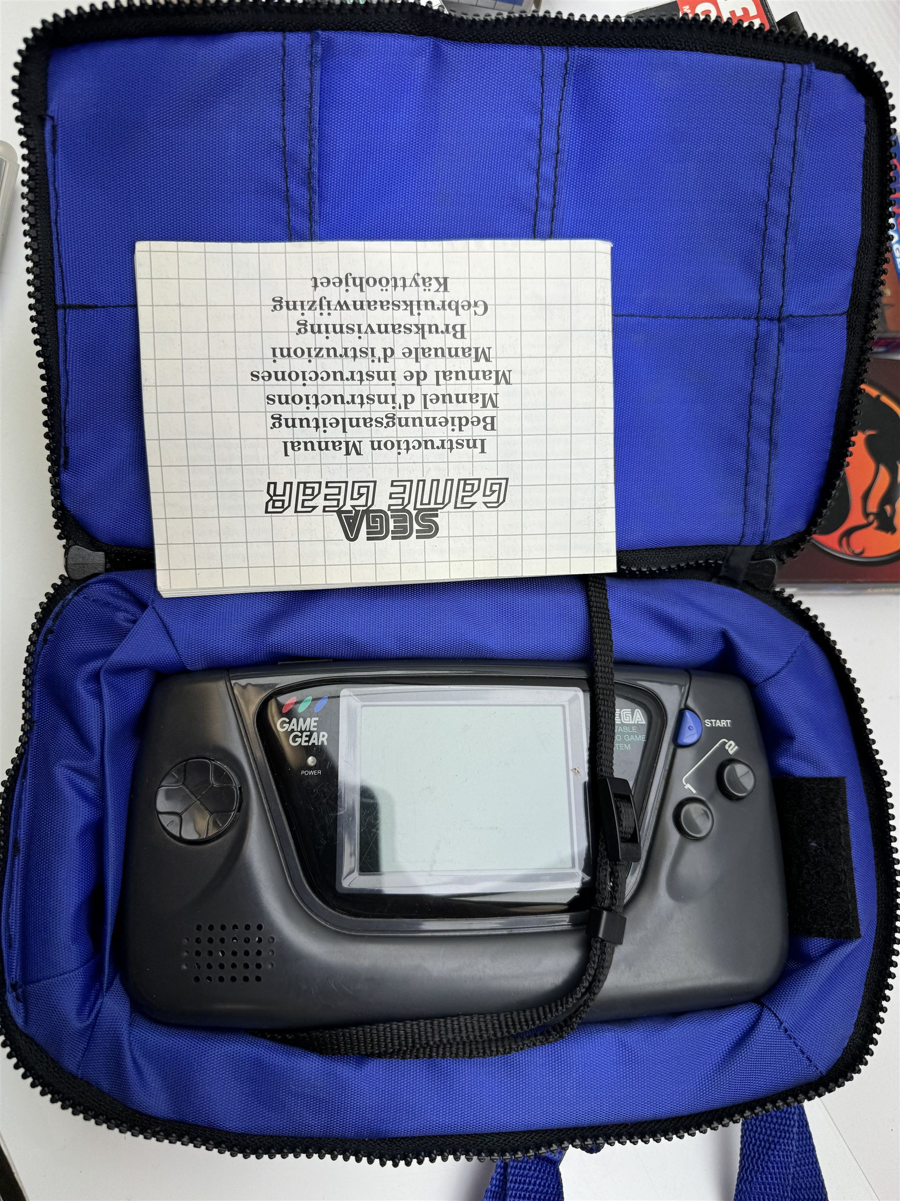 Sega Game Gear handheld console, in Logic 3 case, together with nine Sega Game Gear games including Sonic The Hedgehog, Columns, Super Monaco GP, Shinobi, Streets of Rage, Mortal Kombat, Lemmings etc, seven with original boxes, and an AC adapter