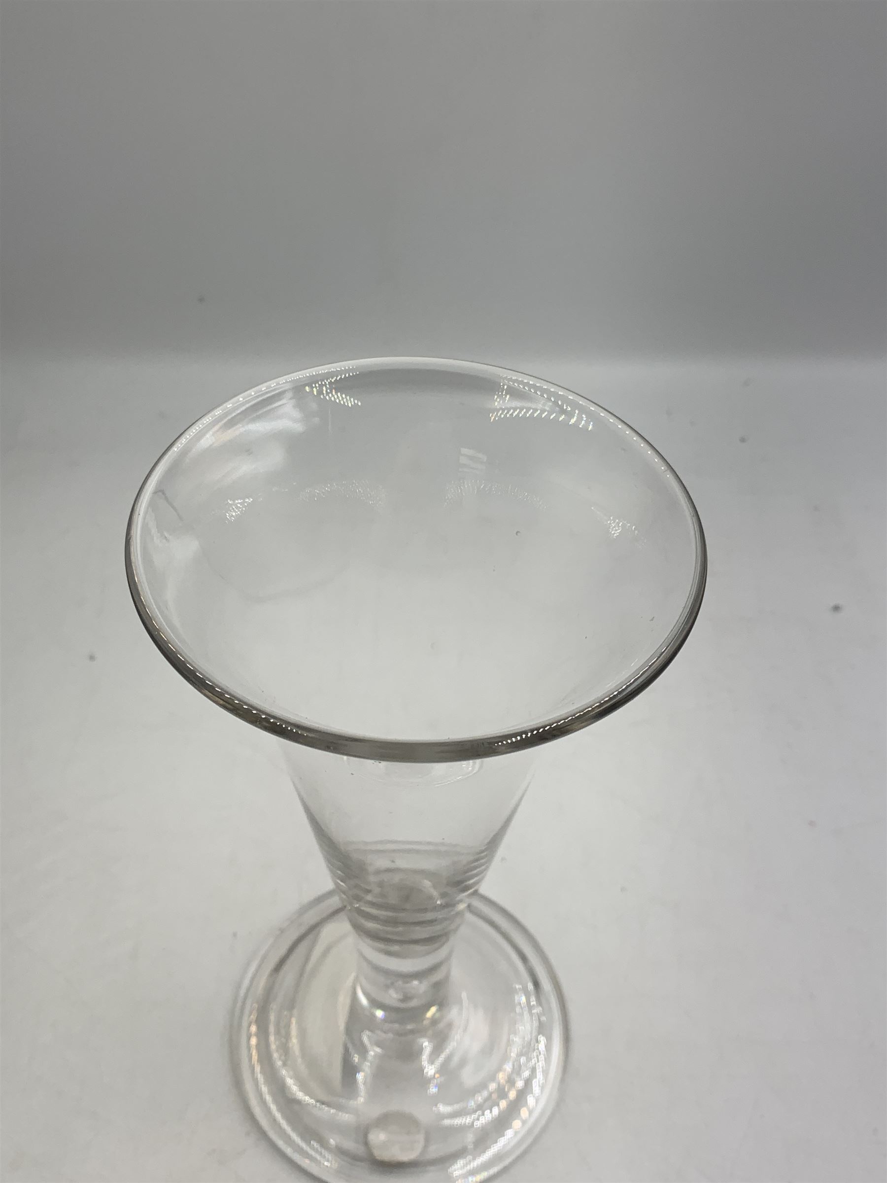 Large 18th century ale glass, circa 1780, with drawn trumpet bowl and flared rim, teardrop stem on a domed folded foot, H20cm