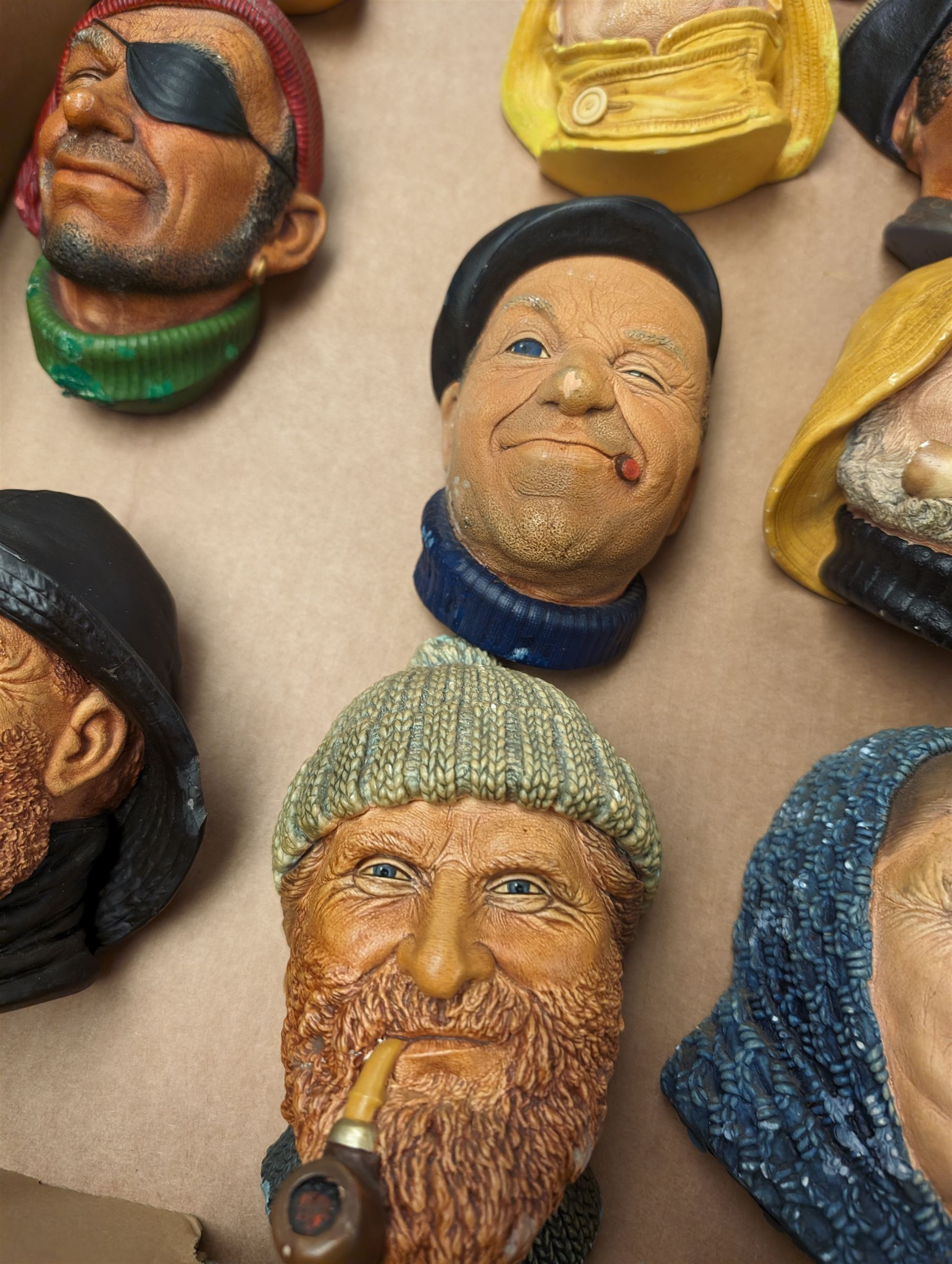 Ten Bossons Chalkware masks, all maritime themed, to include fishermen, pirates, etc 