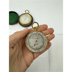 Lowdon Dundee, an early 20th century leather cased pocket barometer with silver dial, D4cm, together with another larger and later example, both cased