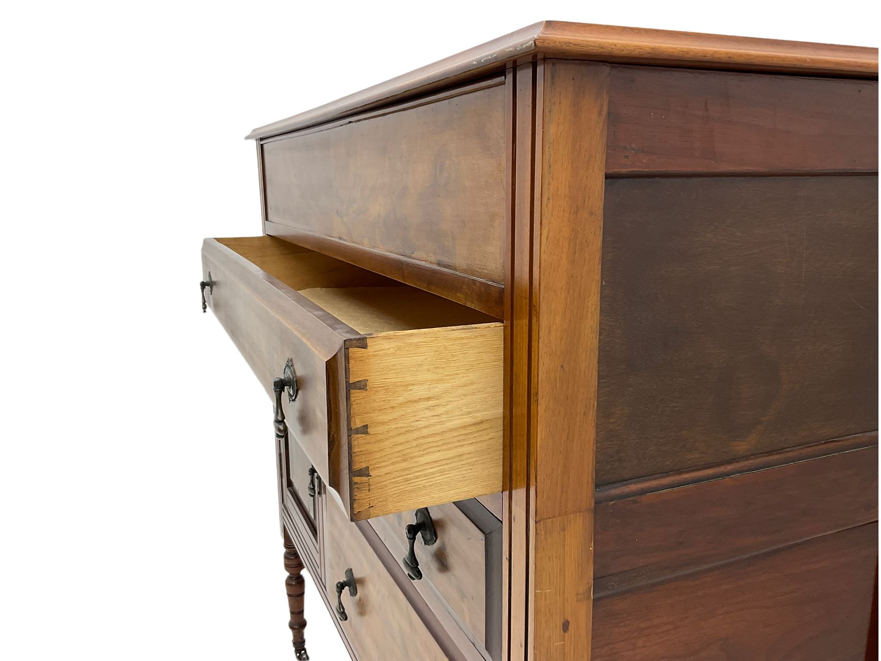 Edwardian walnut gentleman's tallboy, moulded hinged lid enclosing divisions, long drawer over two short drawers and panelled cupboard, turned supports terminating at ceramic castors