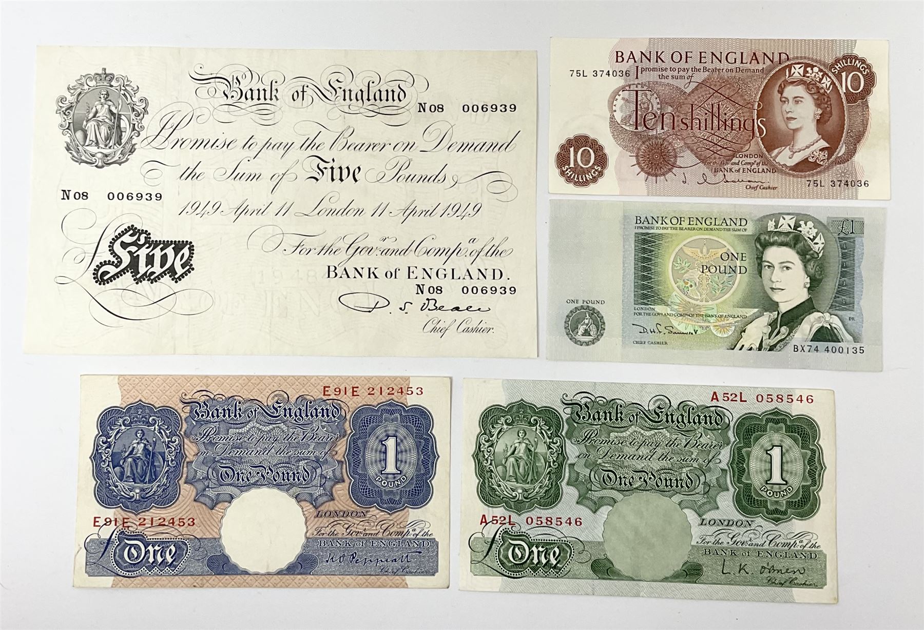 Bank of England Beale white five pound note 'N08' 'London 11 April 1949', Peppiatt emergency issue one pound 'E91E', O'Brien Series A Britannia one pound note 'A52L' and two other banknotes