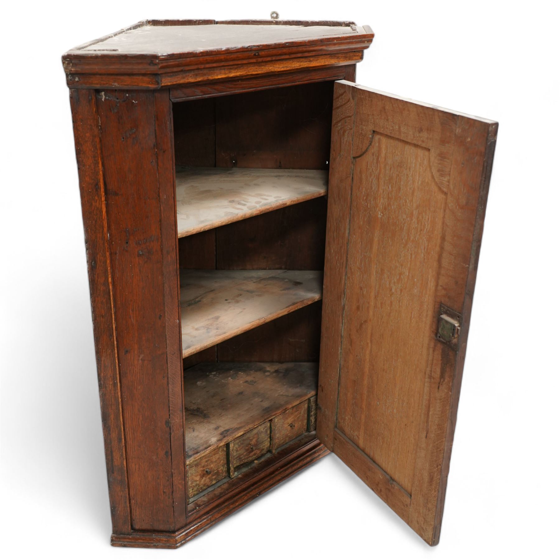 George III oak wall hanging corner cupboard, shaped fielded panelled door enclosing shelves and spice drawers