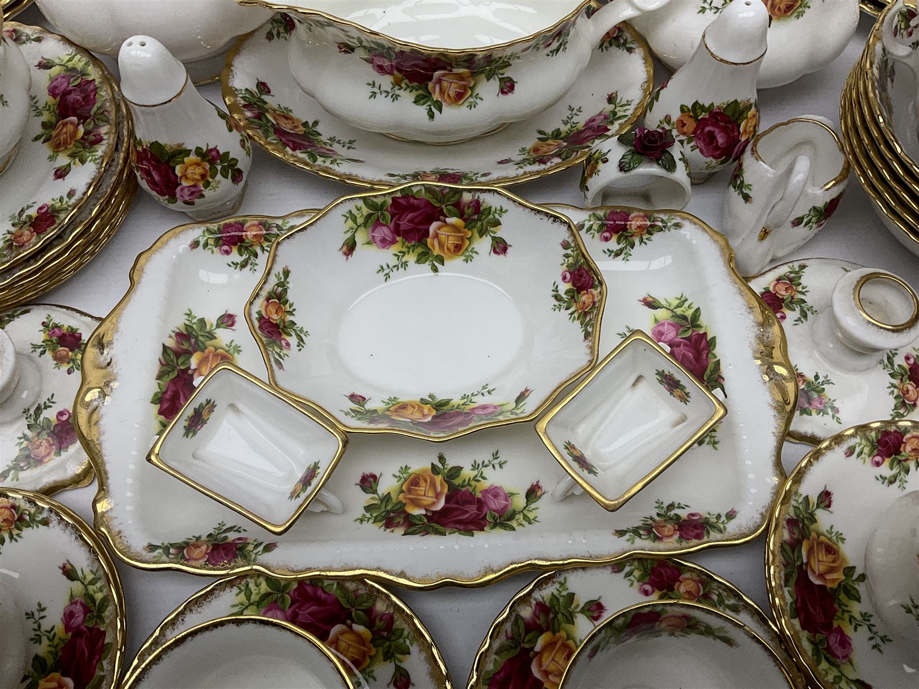 Royal Albert Old Country Roses pattern coffee service for six, comprising coffee pot, milk jug, cups and saucers, cake plate, together with miniature teapot, six teacups and saucers, six dinner plates, six side plates etc 