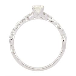 White gold single stone round brilliant cut diamond ring, with diamond set crossover design shoulders, hallmarked 9ct, total diamond weight 0.66 carat